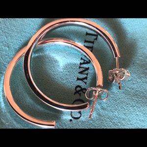 Authentic medium narrow Tiffany&Co. hoop earrings in excellent condition.